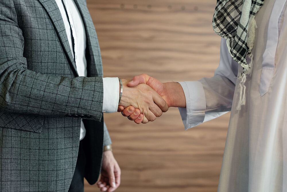 Two business partners shaking hands