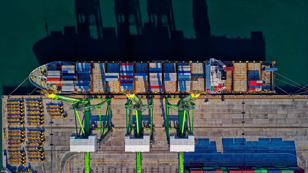 Aerial view of a container ship at a busy port